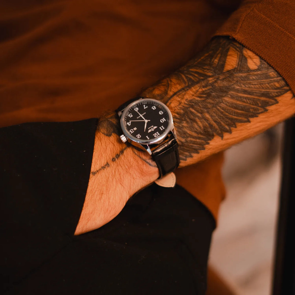 DALMONT Winner automatic watch on the wrist with a brown knit sleeve